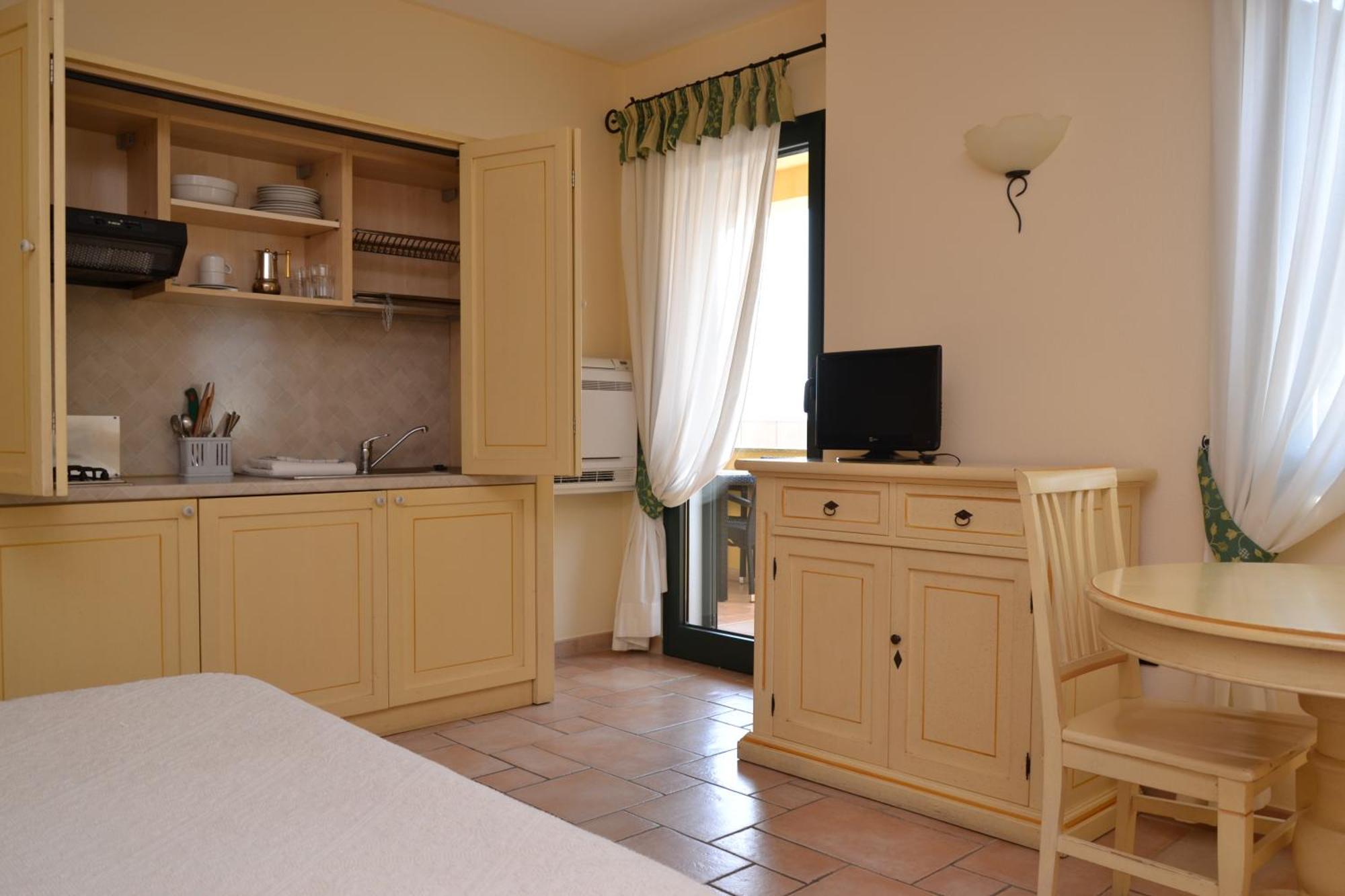 Hotel Villa Del Parco Ла-Маддалена Номер фото